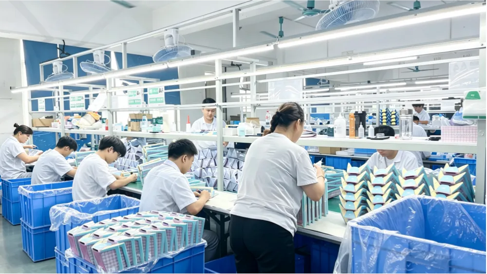 Stationery factory production line with workers operating on the assembly floor